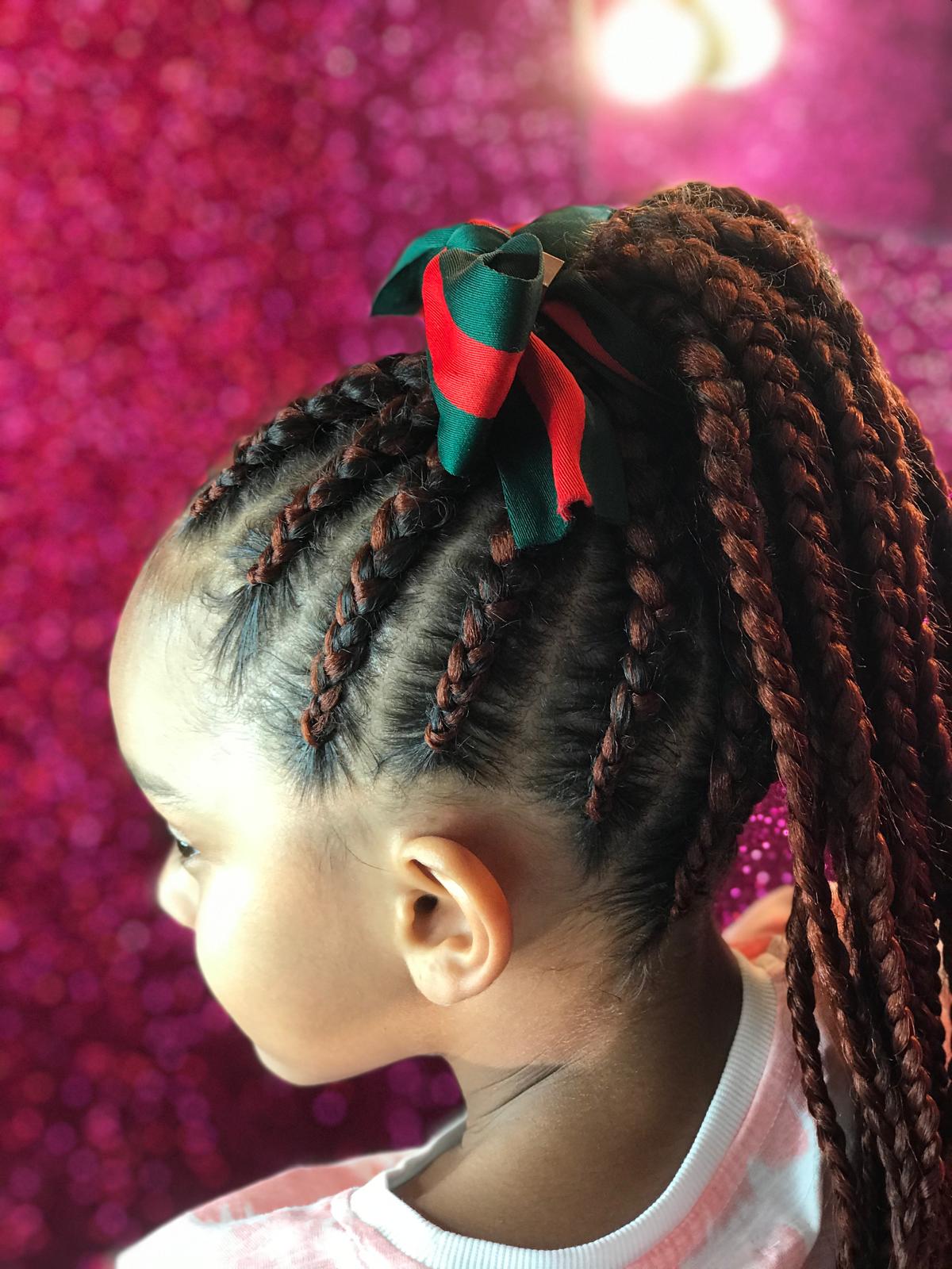 Kids cornrow braids with ponytail and bow